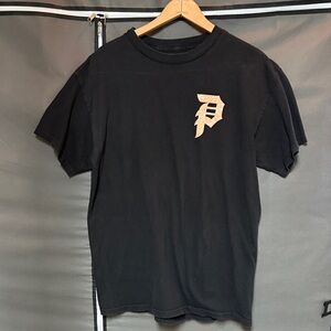 Primitive Black Tee with Peach Logo and Graphic on Back